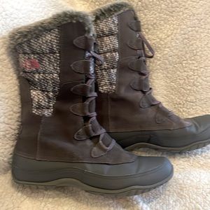 The North Face Woman’s fur lined waterproof snow boots.